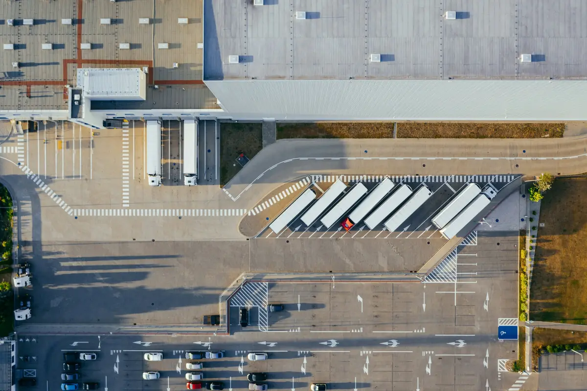 Commercial building with a row of overhead loading doors, seen from above